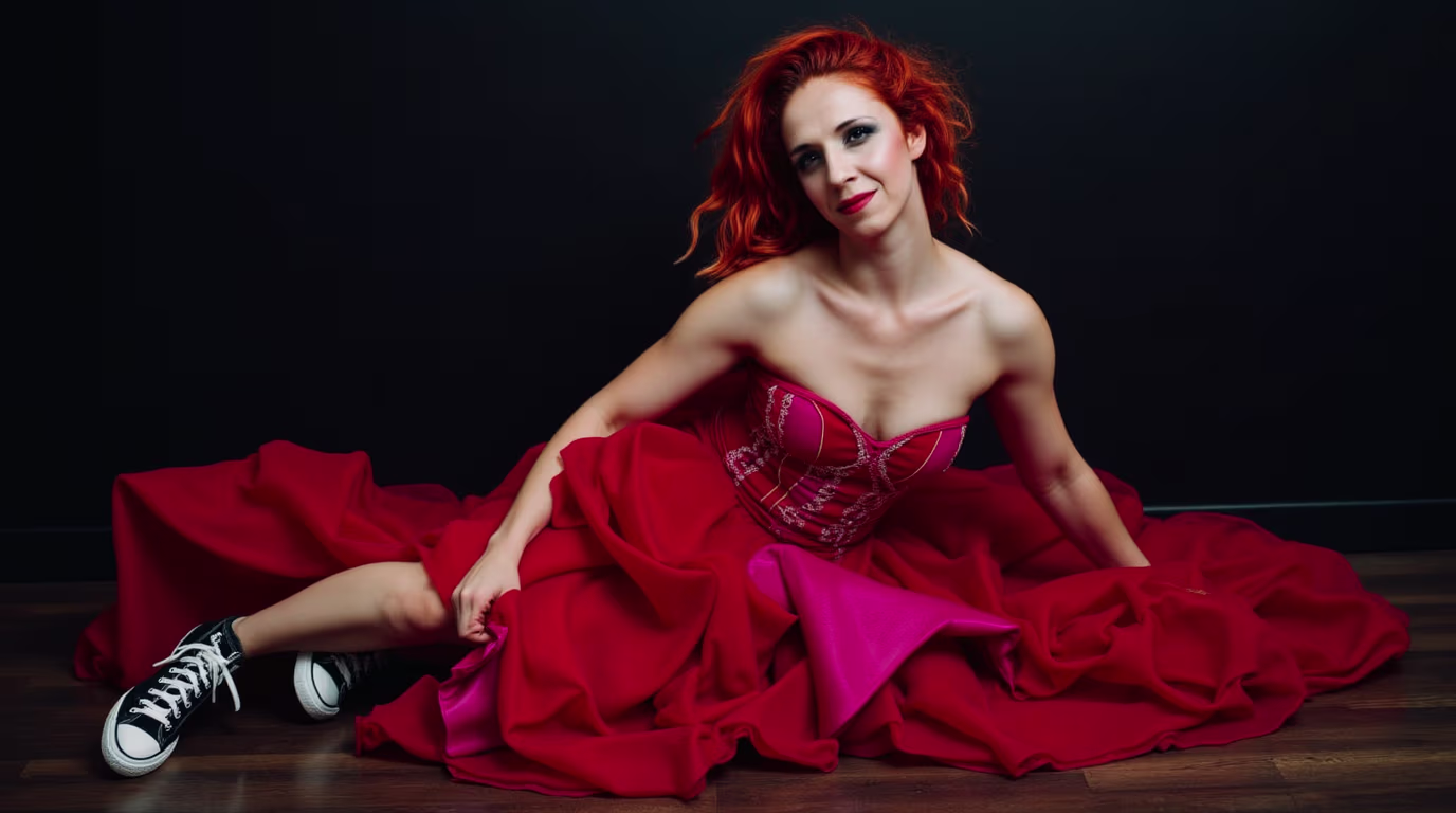 Tereza Škraňka in a blood-red couture dress with magenta details and black Converse sneakers, editorial portrait for her blog post on AI as a quality audit for personal brands